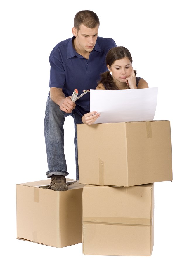 Couple with packing boxes ready for removalists Sunshine Coast.